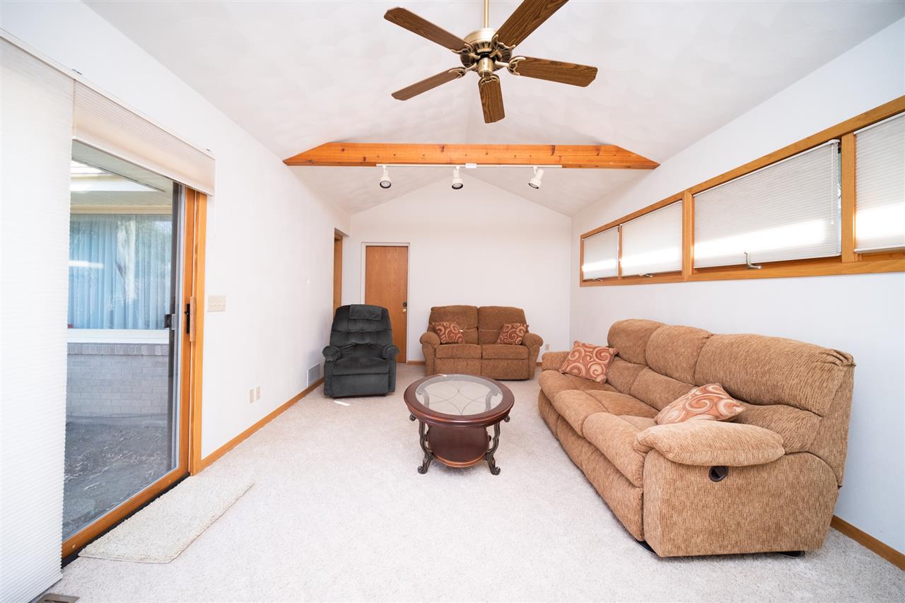 4228 Pinecrest Road Rockford, IL 61107 - Photo 16 of 30 a living room with furniture and a window