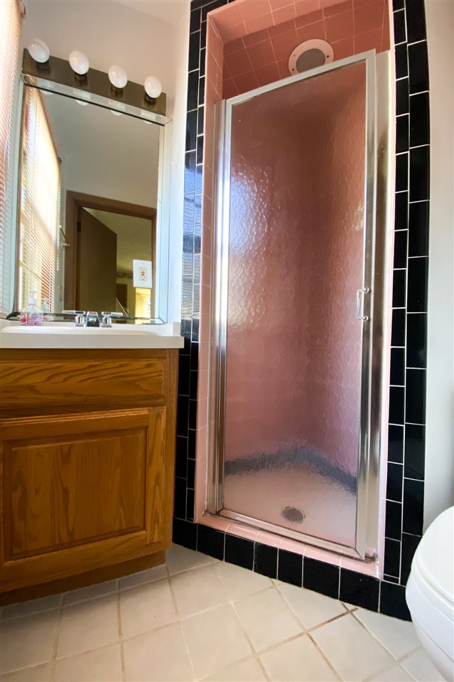 4228 Pinecrest Road Rockford, IL 61107 - Photo 19 of 30 a view of a bathroom with a shower and a sink