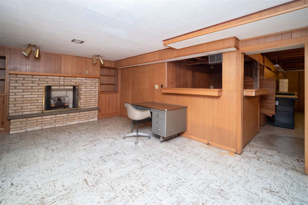 4228 Pinecrest Road Rockford, IL 61107 - Photo 25 of 30 a view of an empty room with a fireplace