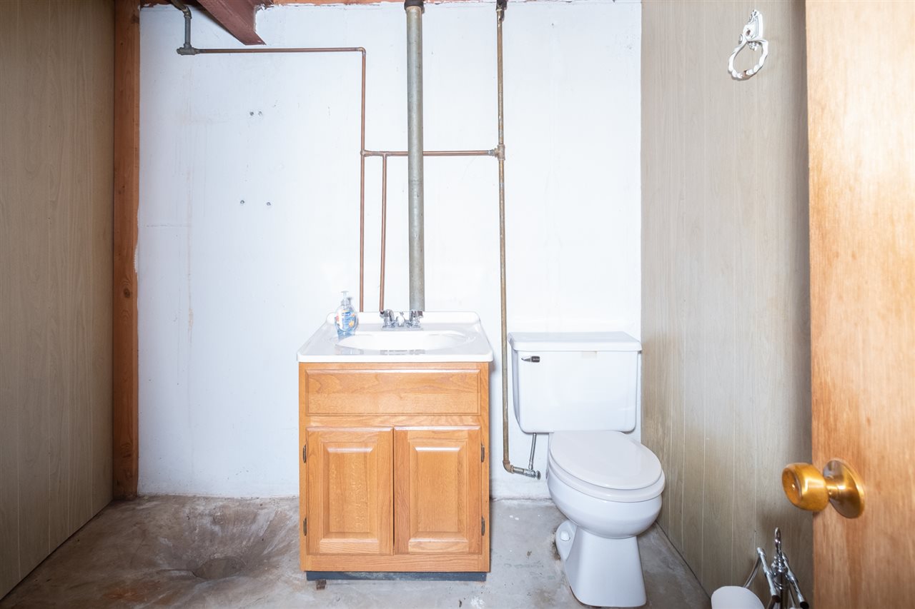 4228 Pinecrest Road Rockford, IL 61107 - Photo 28 of 30 a bathroom with a toilet a sink and a window