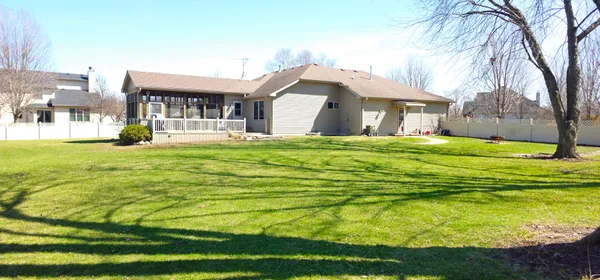 a view of a house with a backyard