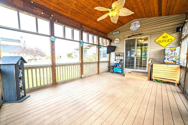 a view of a porch with wooden floor