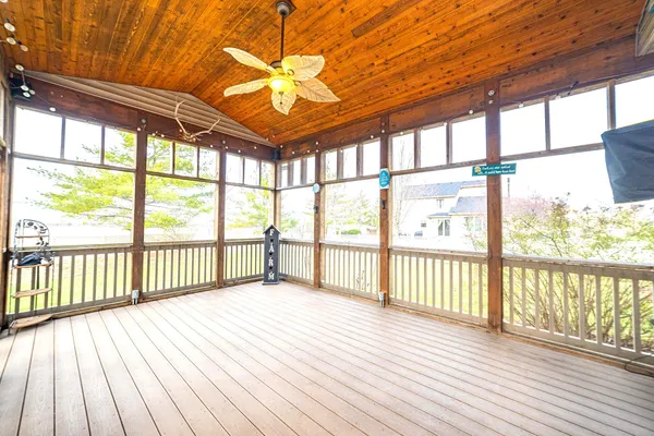 a view of a porch with wooden floor