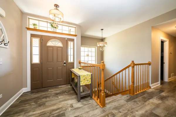 a view of front door with a mirror