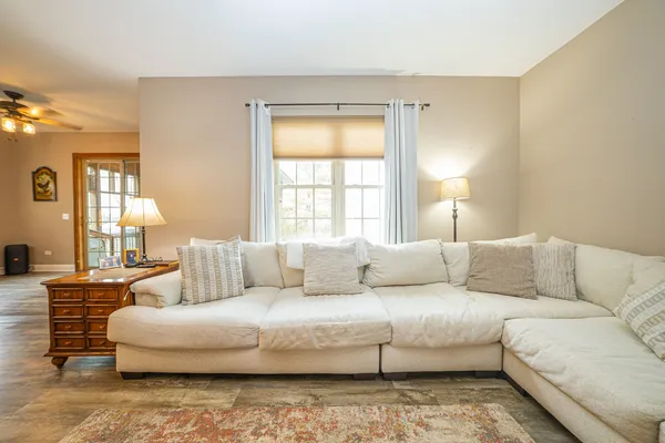 a large kitchen with kitchen island a large counter space a sink appliances and cabinets
