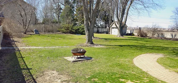 a view of a swimming pool with a yard