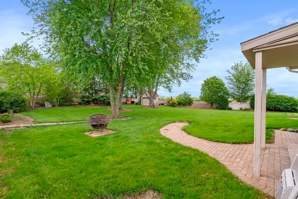 a view of a garden with an outdoor space