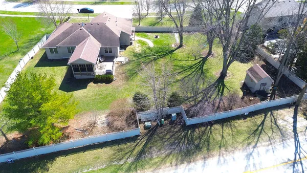 a house view with swimming pool in front of it