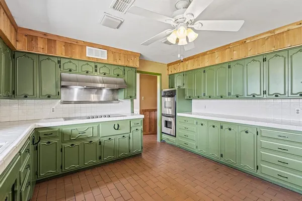 a kitchen with cabinets a sink and dishwasher
