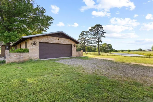 a view of a swimming pool with an outdoor space and seating area
