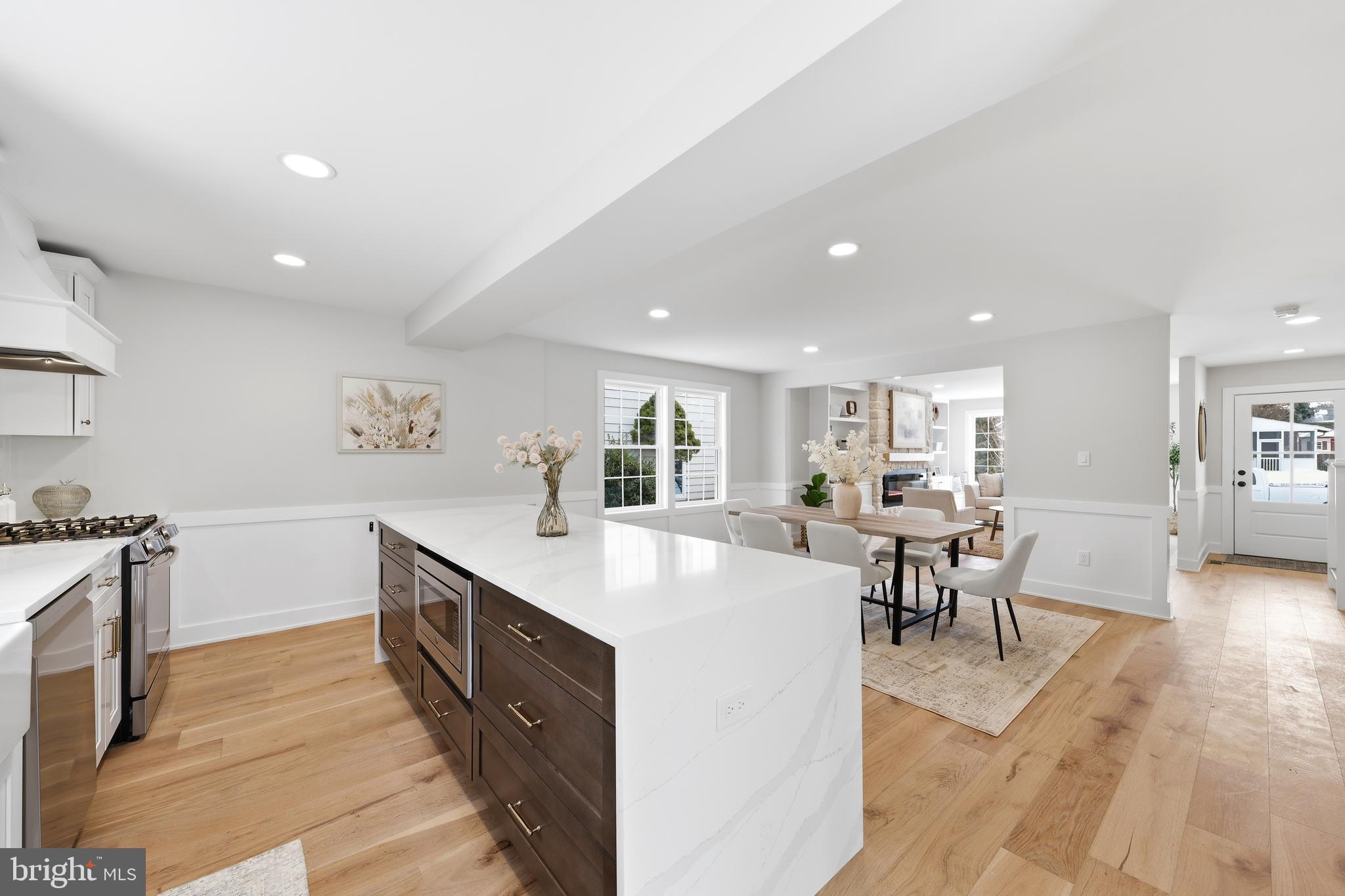 615 Pardee Lane Haddonfield, NJ 08033 - Photo 19 of 37 a large kitchen with kitchen island a sink a counter space and stainless steel appliances