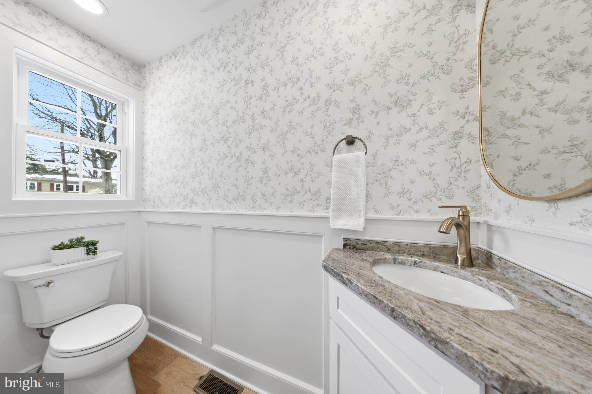 615 Pardee Lane Haddonfield, NJ 08033 - Photo 21 of 37 a bathroom with a granite countertop sink a toilet and a mirror