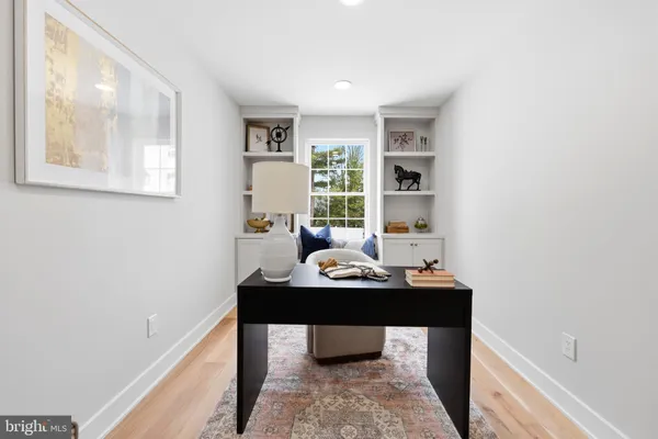 a bathroom with a granite countertop sink a toilet and a mirror