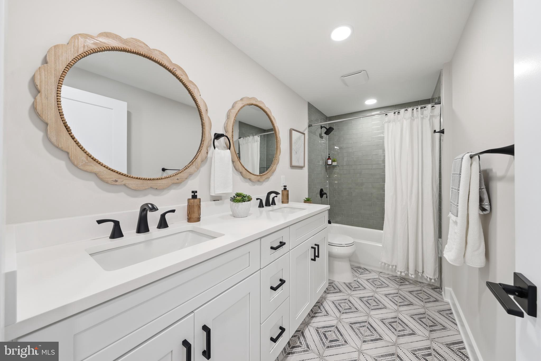 615 Pardee Lane Haddonfield, NJ 08033 - Photo 31 of 37 a bathroom with a double vanity sink mirror and a toilet
