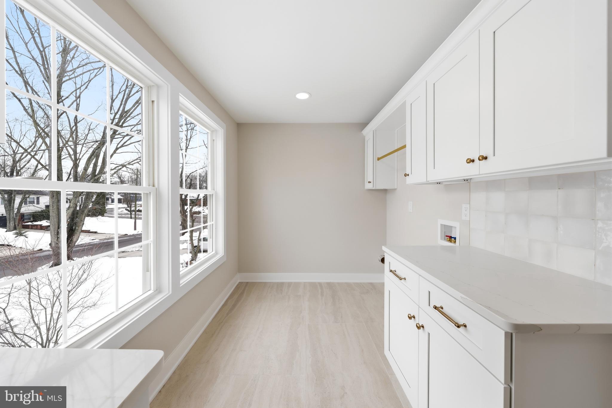 615 Pardee Lane Haddonfield, NJ 08033 - Photo 32 of 37 a view of a kitchen with wooden floor and cabinets