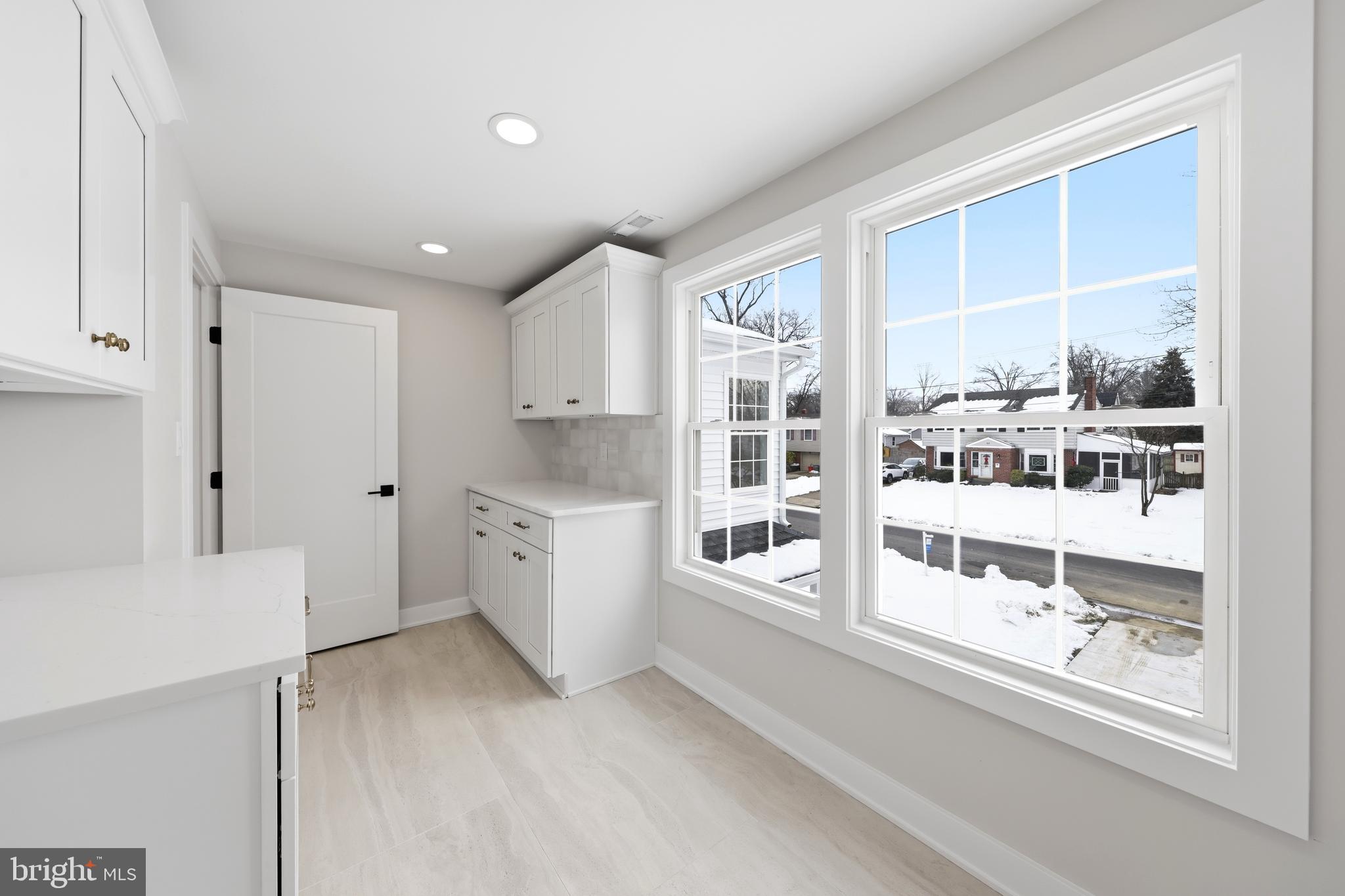 615 Pardee Lane Haddonfield, NJ 08033 - Photo 33 of 37 a view of open kitchen with white cabinets and wooden floor