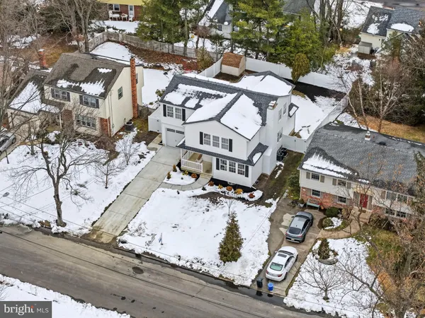 an aerial view of residential house with parking