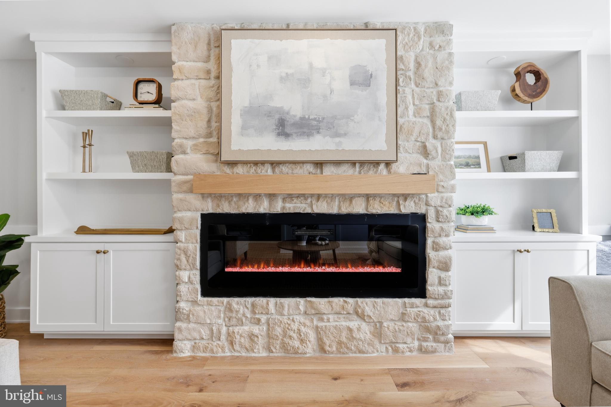 615 Pardee Lane Haddonfield, NJ 08033 - Photo 9 of 37 a living room with a fireplace and a wooden floor