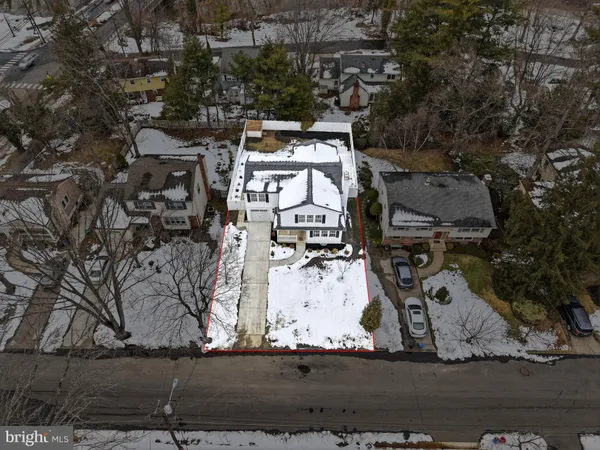 an aerial view of a house with a parking space