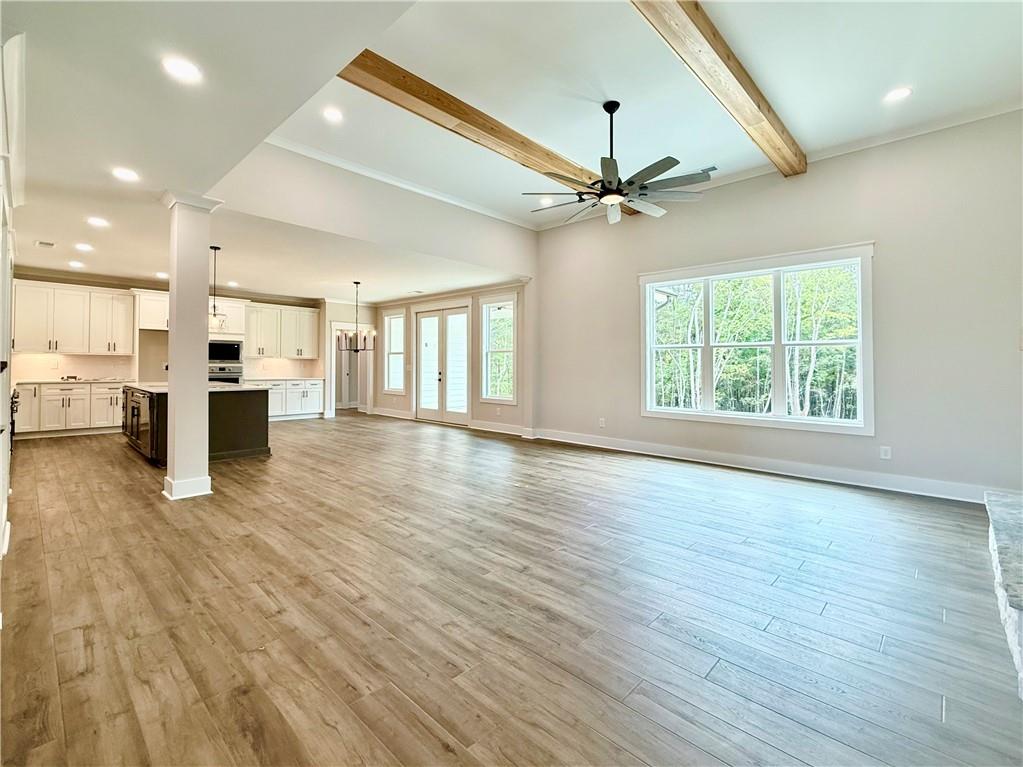 141 Palisade Drive Rydal, GA 30171 - Photo 11 of 50 a view of an empty room with a window and wooden floor