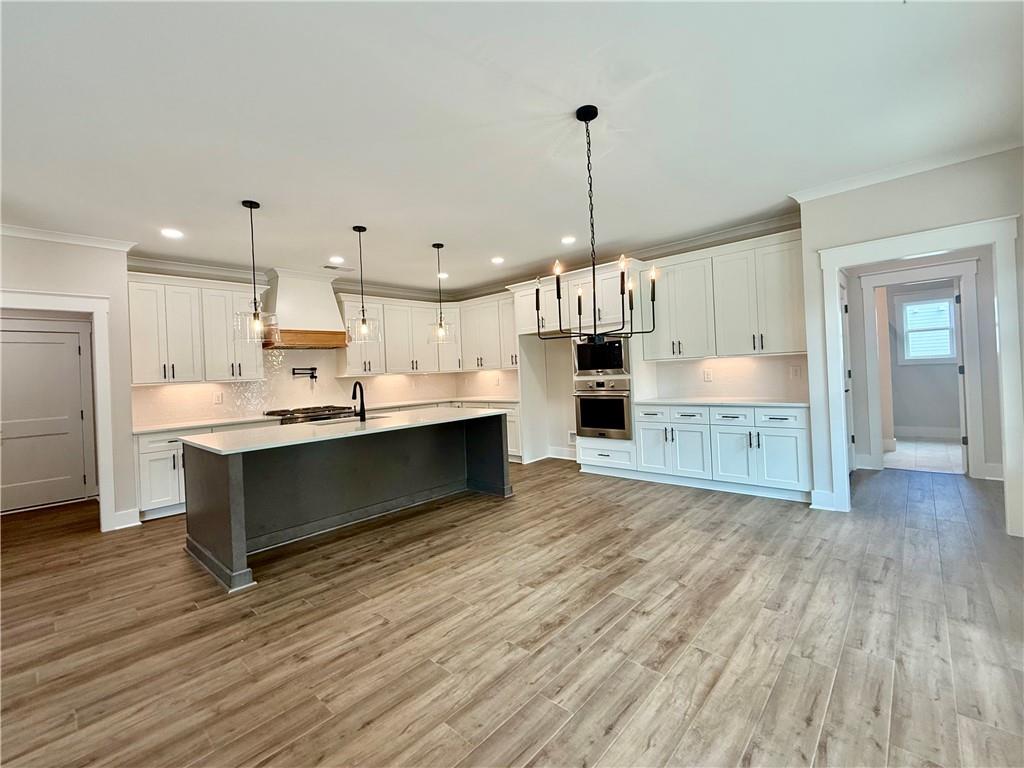141 Palisade Drive Rydal, GA 30171 - Photo 16 of 50 a large kitchen with a lot of cabinets and stainless steel appliances
