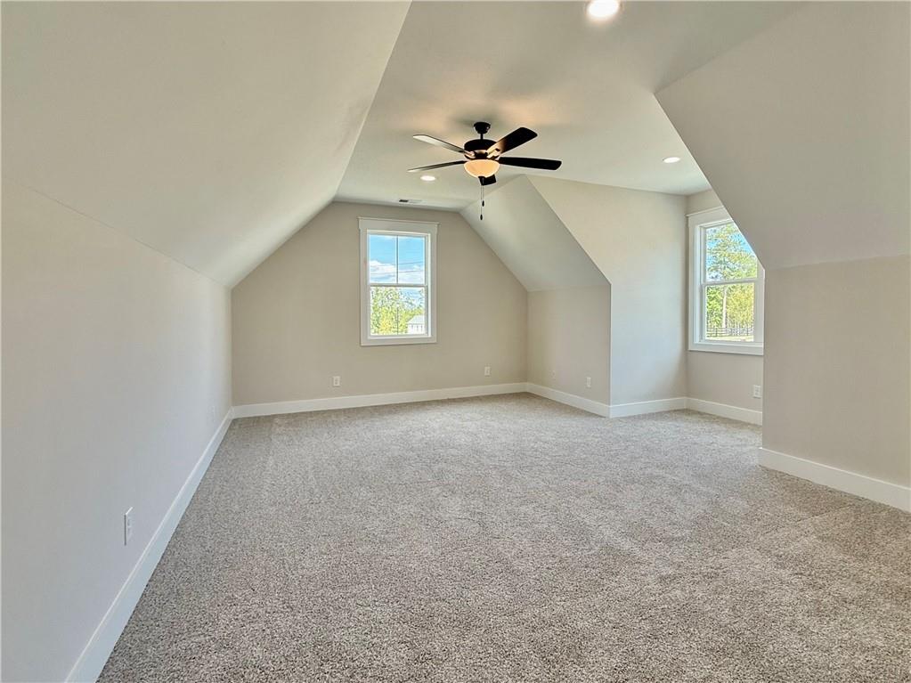 141 Palisade Drive Rydal, GA 30171 - Photo 37 of 50 an empty room with windows and ceiling fan view