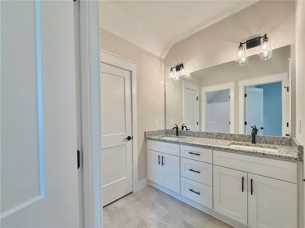 a bathroom with a toilet and a bathtub