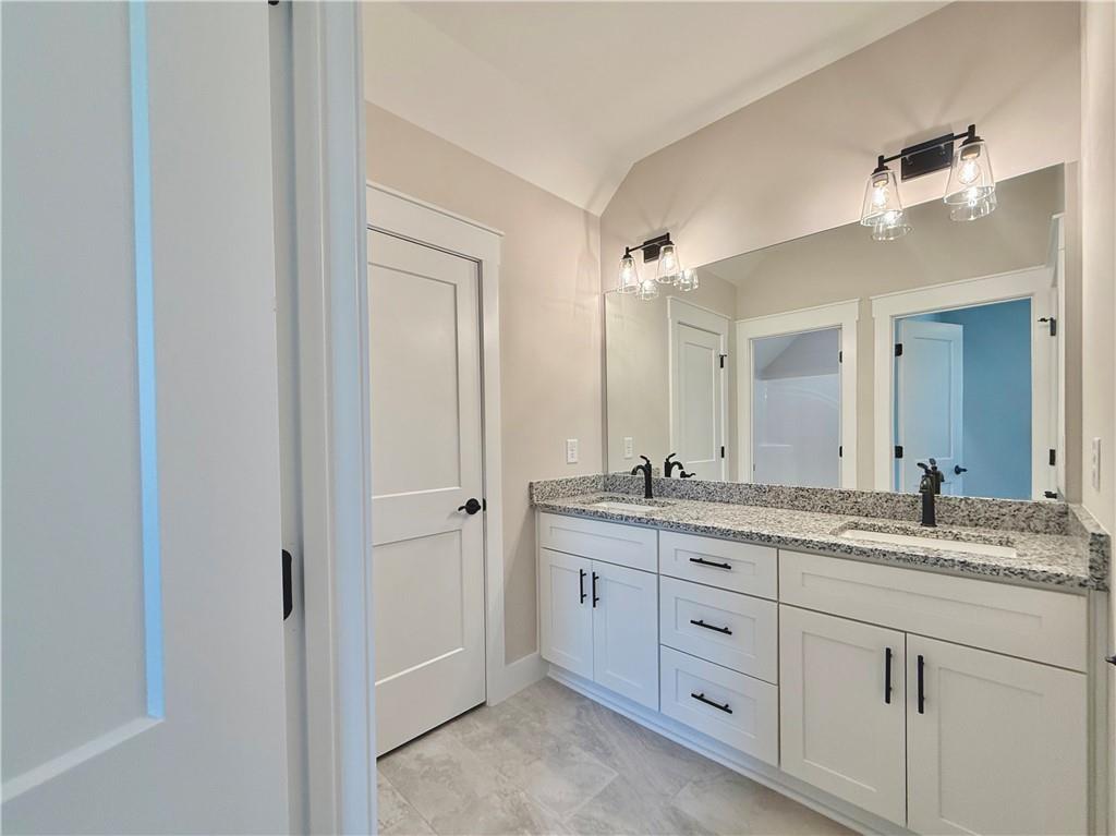 141 Palisade Drive Rydal, GA 30171 - Photo 44 of 50 a bathroom with a granite countertop sink mirror and