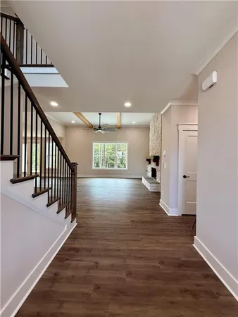 a view of an entryway with wooden floor
