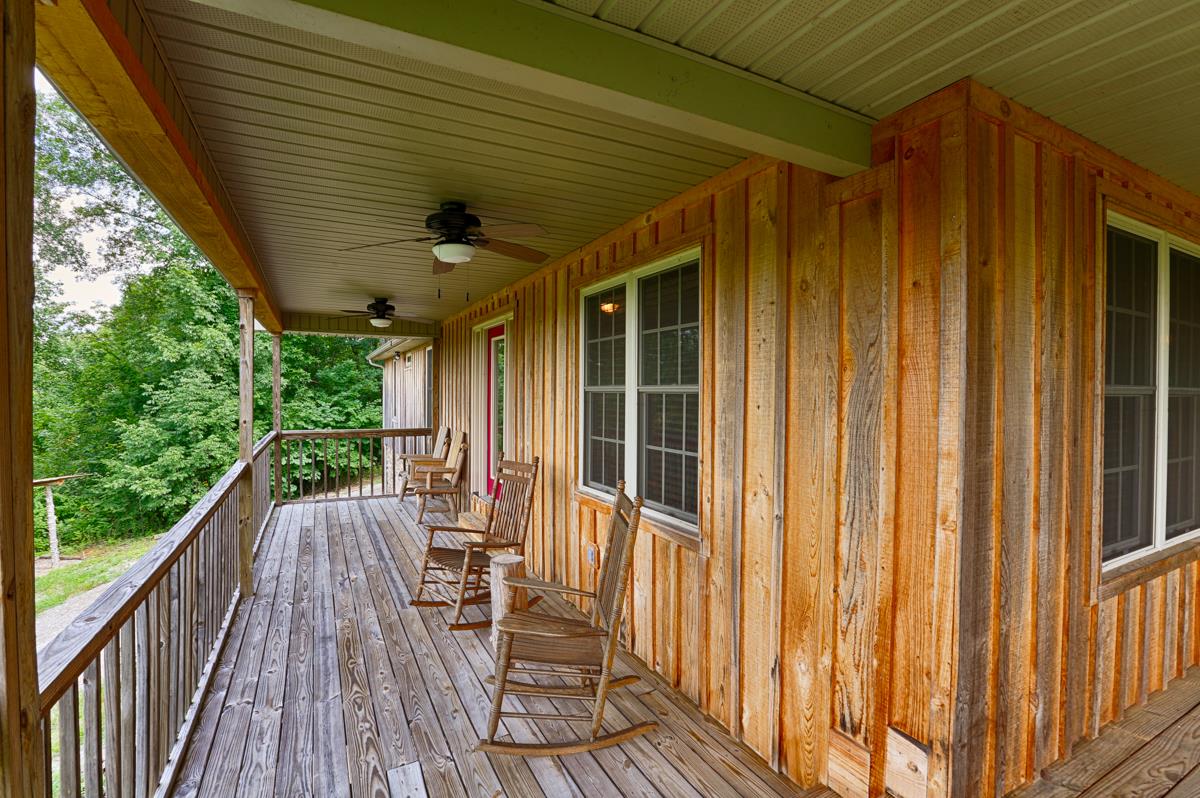 561 Shoal Creek Road Goodspring, TN 38460 - Photo 4 of 30 a view of balcony with wooden floor and outdoor space
