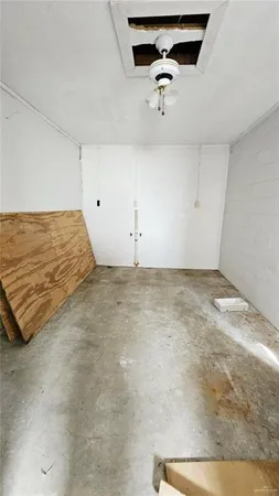 a view of a room with a ceiling fan