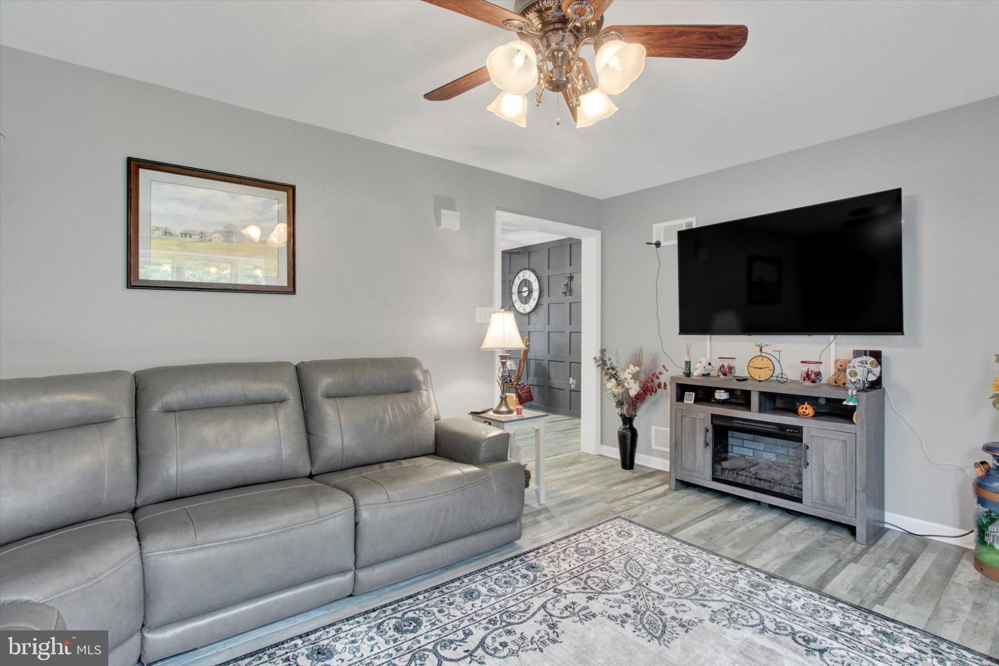 1484 Fire Hall Road Spring Grove, PA 17362 - Photo 5 of 19 a living room with furniture and a flat screen tv