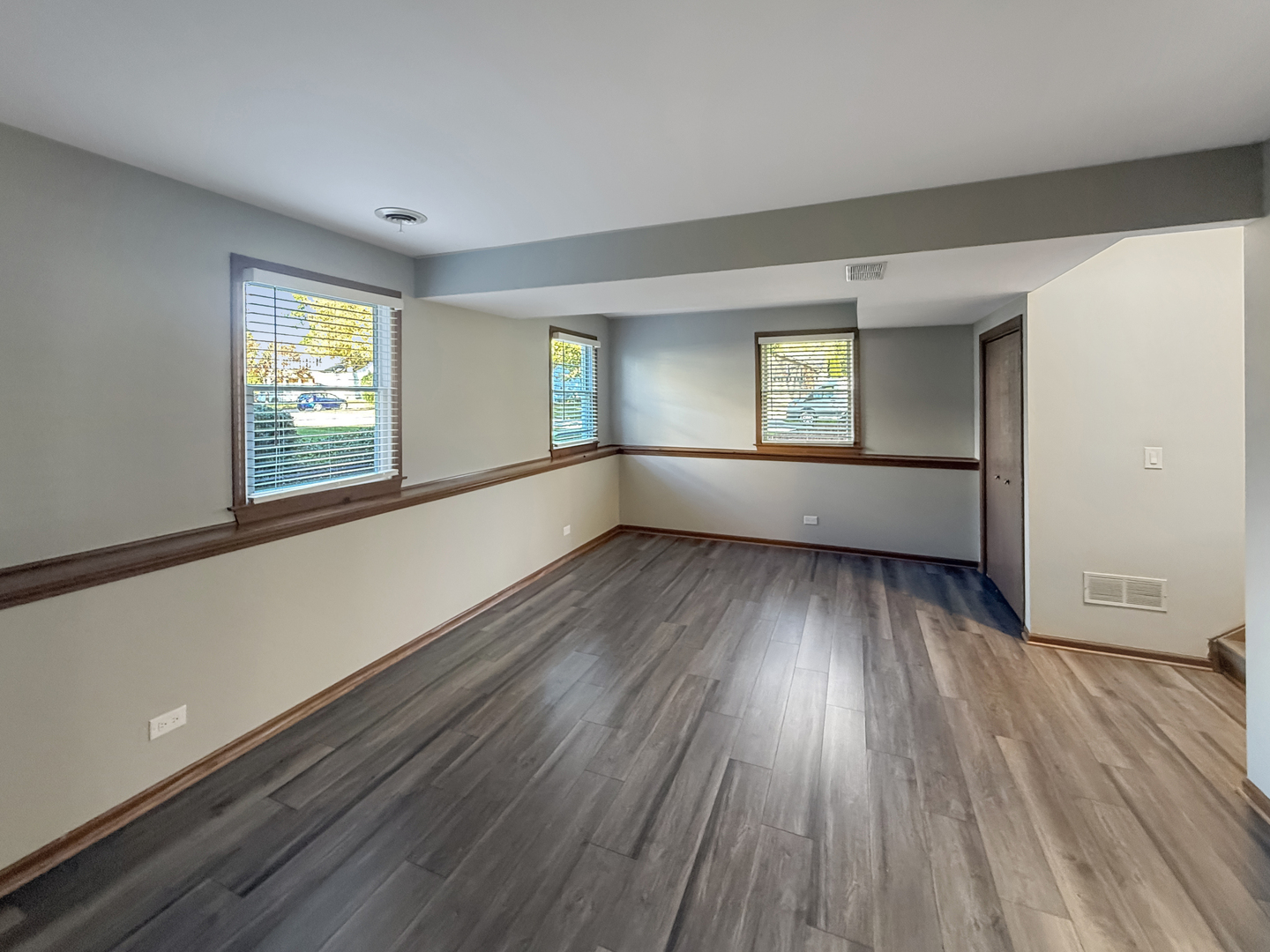 139 Spuhler Drive, Unit 139 Batavia, IL 60510 - Photo 8 of 12 wooden floor in an empty room with a window