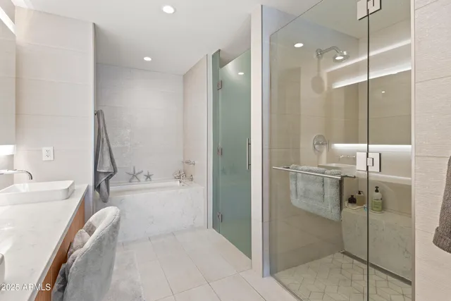 a bathroom with a bathtub and a sink