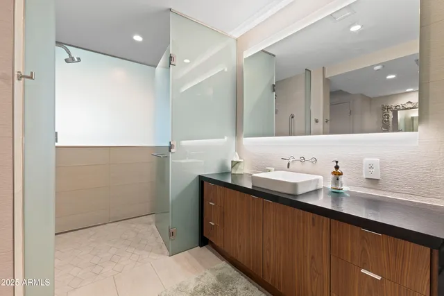 a bathroom with a sink and a mirror