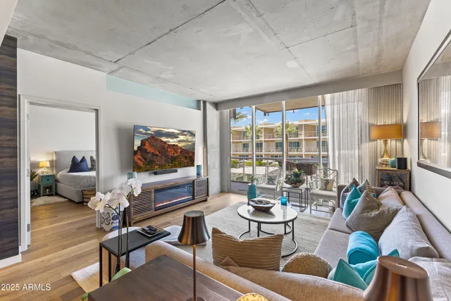 a living room with furniture and a flat screen tv
