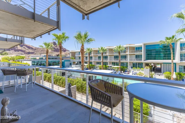 an outdoor sitting area with chairs