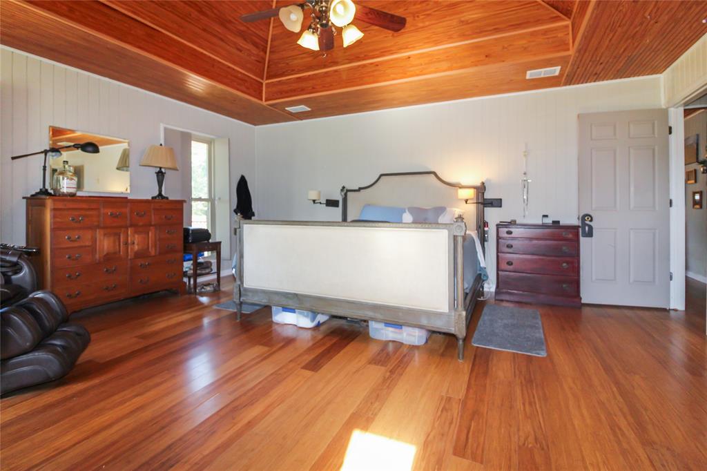 1001 Sandy Ridge Road Scurry, TX 75158 - Photo 26 of 35 Vaulted wood-paneled ceiling with a central fan light fixture
