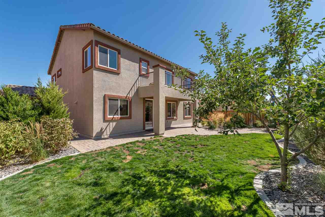 1623 Crescent Pointe Way Reno, NV 89523 - Photo 18 of 24 a front view of a house with a garden
