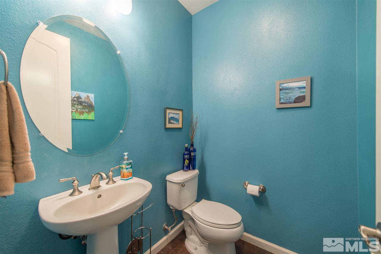 1623 Crescent Pointe Way Reno, NV 89523 - Photo 3 of 24 a bathroom with a sink mirror and toilet