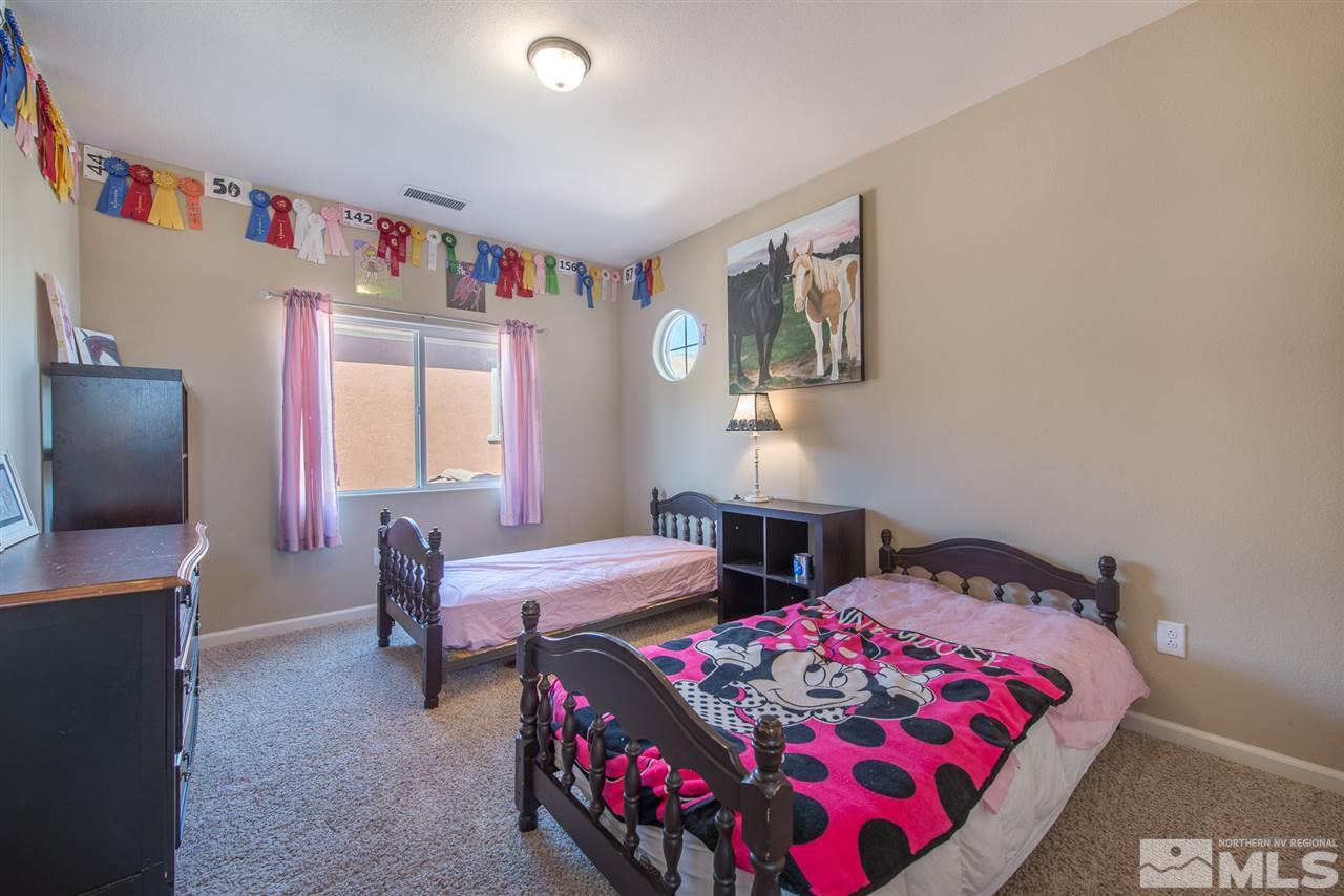 1623 Crescent Pointe Way Reno, NV 89523 - Photo 4 of 24 a bedroom with furniture and a window