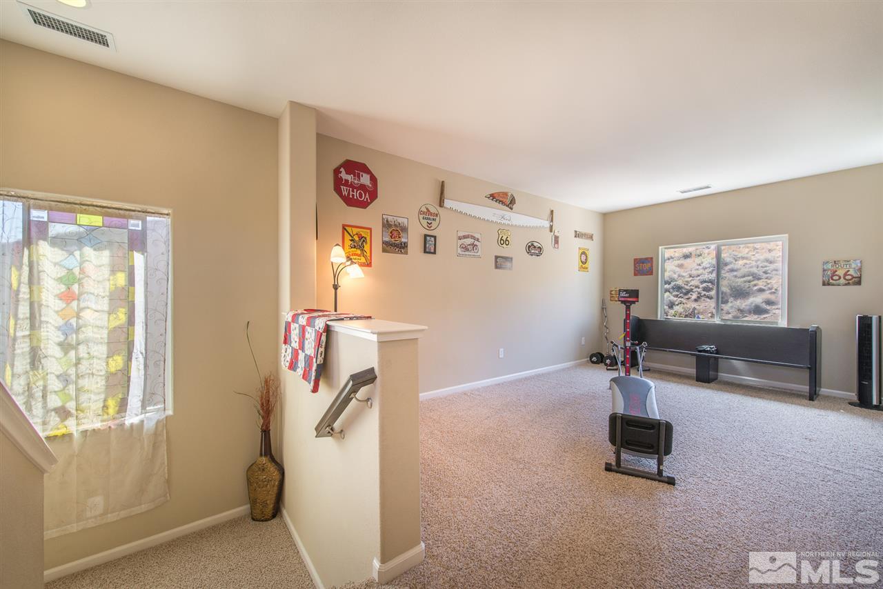 1623 Crescent Pointe Way Reno, NV 89523 - Photo 8 of 24 a room with gym equipment and a window