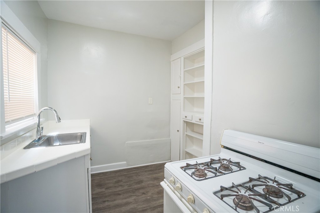 1495 Cedar Avenue Long Beach, CA 90813 - Photo 12 of 34 a kitchen with a sink stove and refrigerator