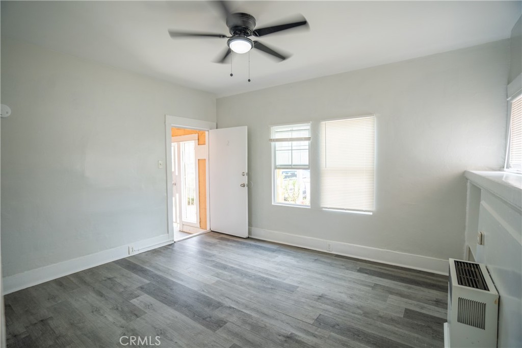 1495 Cedar Avenue Long Beach, CA 90813 - Photo 13 of 34 a view of an empty room with wooden floor and a window