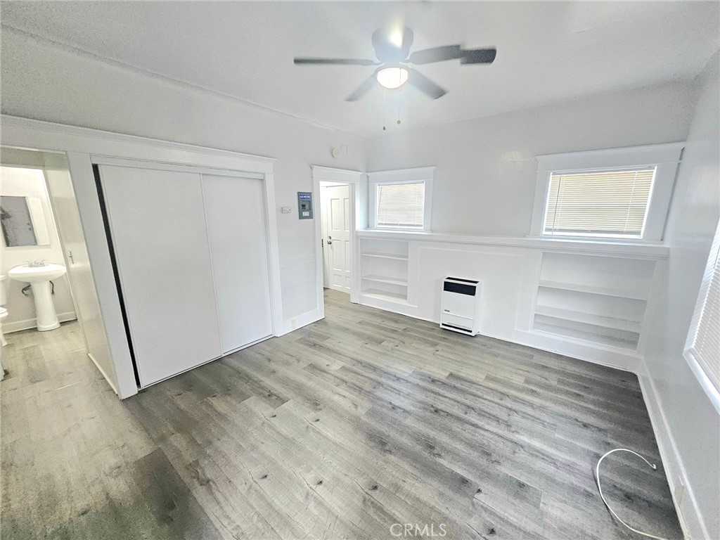 1495 Cedar Avenue Long Beach, CA 90813 - Photo 19 of 34 a view of empty room with wooden floor and fan