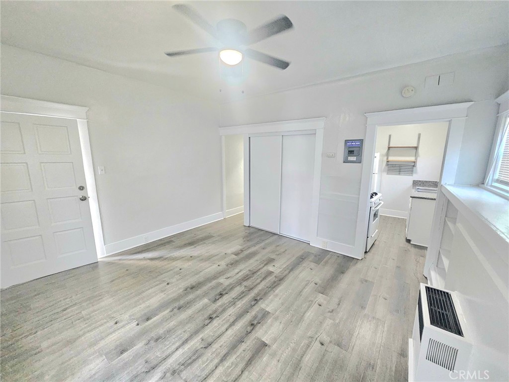 1495 Cedar Avenue Long Beach, CA 90813 - Photo 21 of 34 an empty room with wooden floor and a ceiling fan