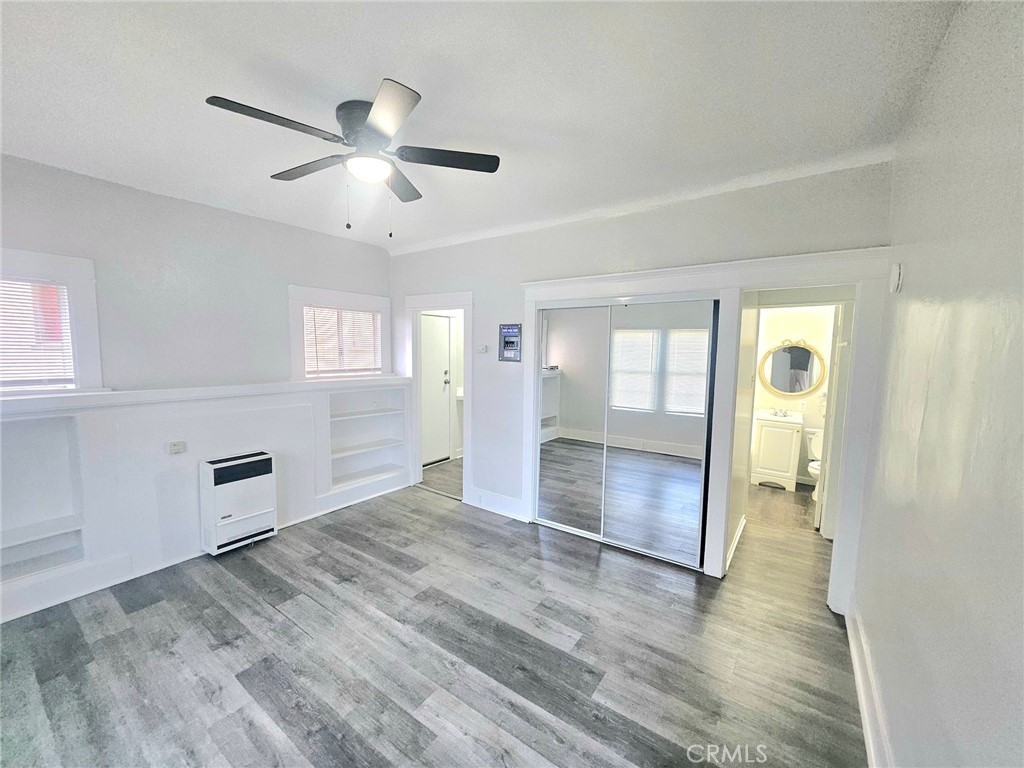 1495 Cedar Avenue Long Beach, CA 90813 - Photo 22 of 34 a view of an empty room with wooden floor and a window