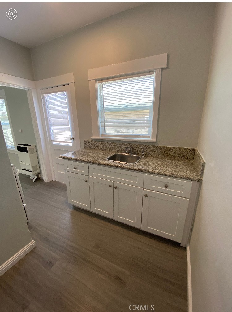 1495 Cedar Avenue Long Beach, CA 90813 - Photo 24 of 34 a view of cabinets wooden floor and a window