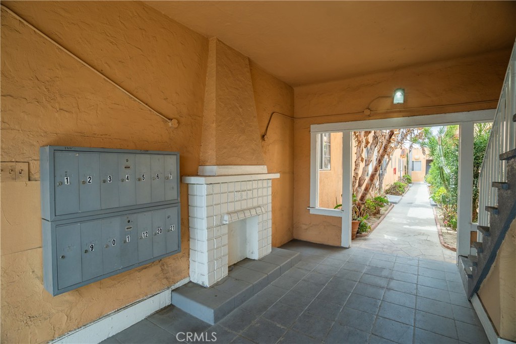 1495 Cedar Avenue Long Beach, CA 90813 - Photo 3 of 34 a view of an empty room with a fireplace and a large window
