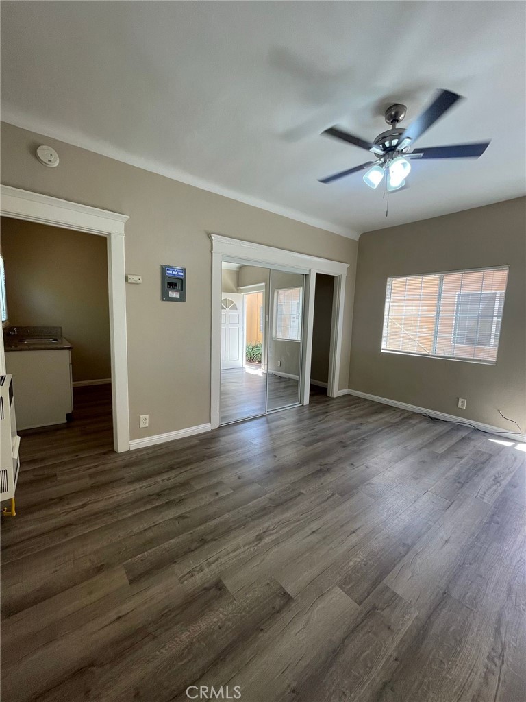 1495 Cedar Avenue Long Beach, CA 90813 - Photo 32 of 34 a view of an empty room with window and wooden floor